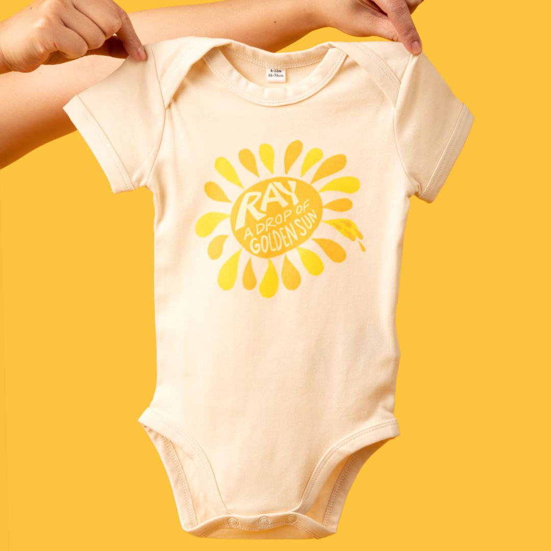 “A Drop Of Golden Sun” Baby Bodysuit