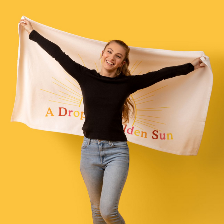 “A Drop Of Golden Sun” Beach Towel