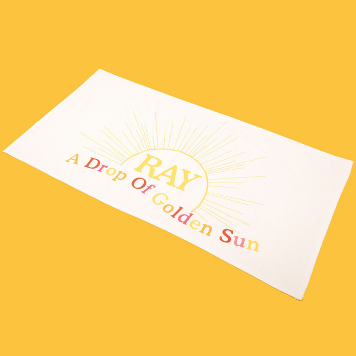 “A Drop Of Golden Sun” Beach Towel