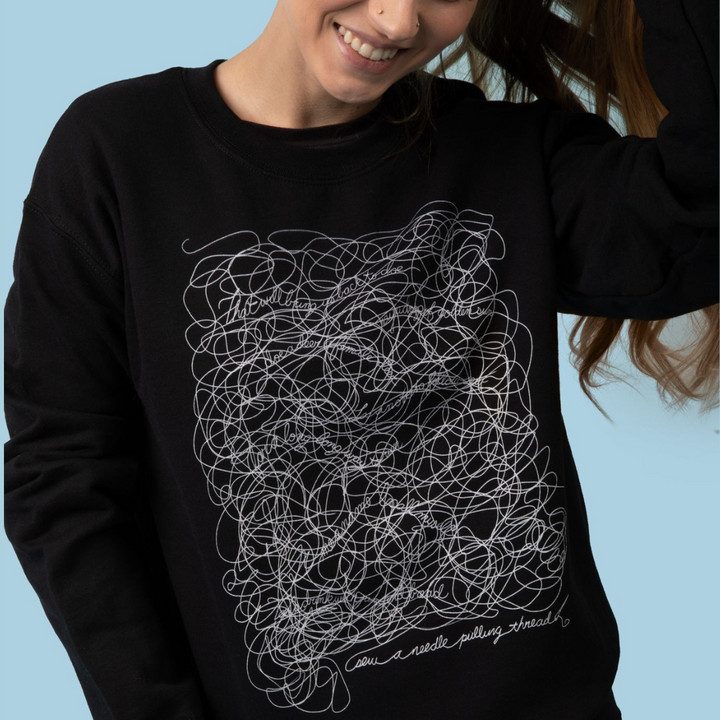 “A Needle Pulling Thread” Sweatshirt